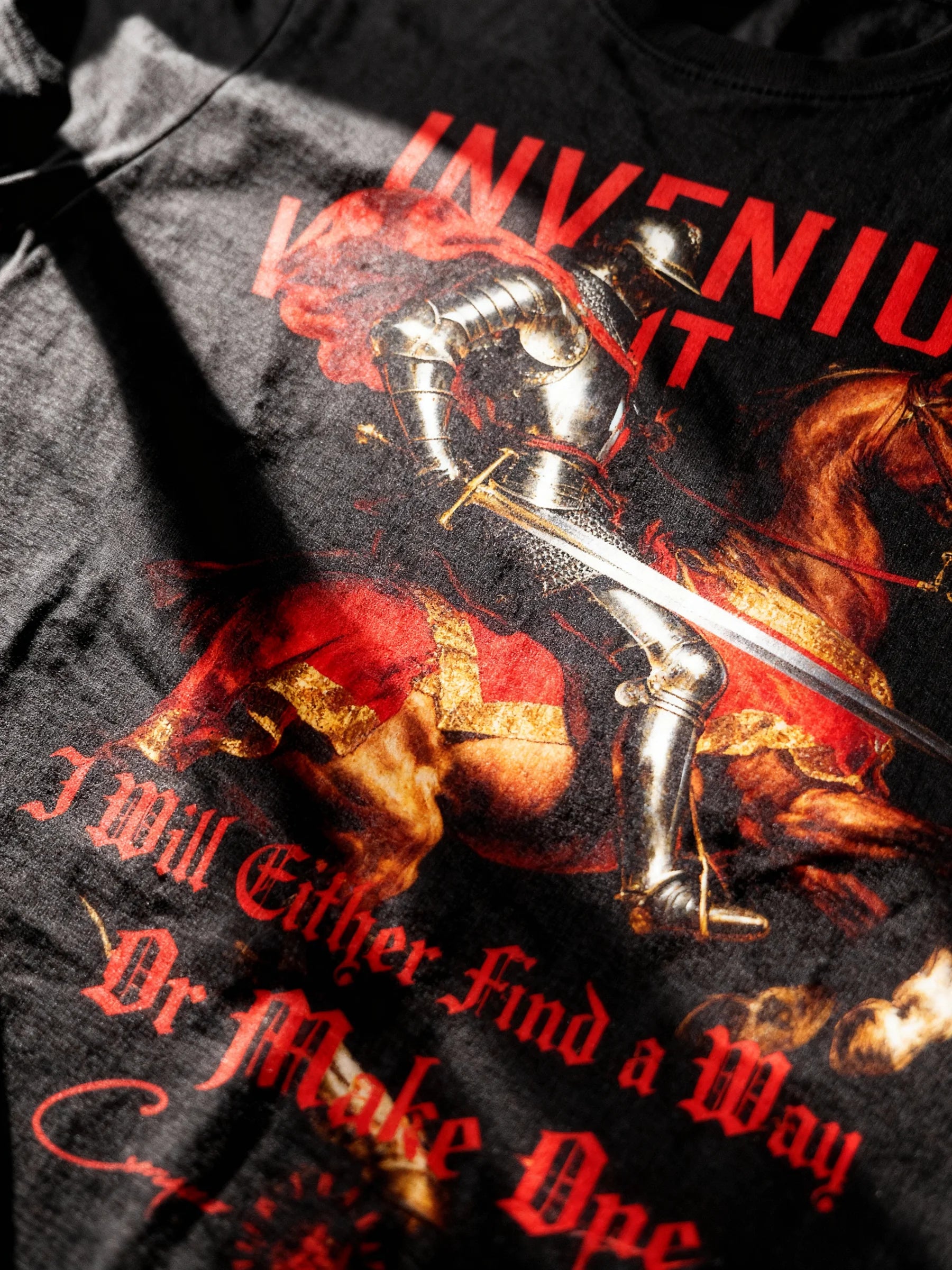 Invenium Viam Aut Faciam graphic tee flat – knight warhorse red cape design, men's black heavyweight gym shirt.