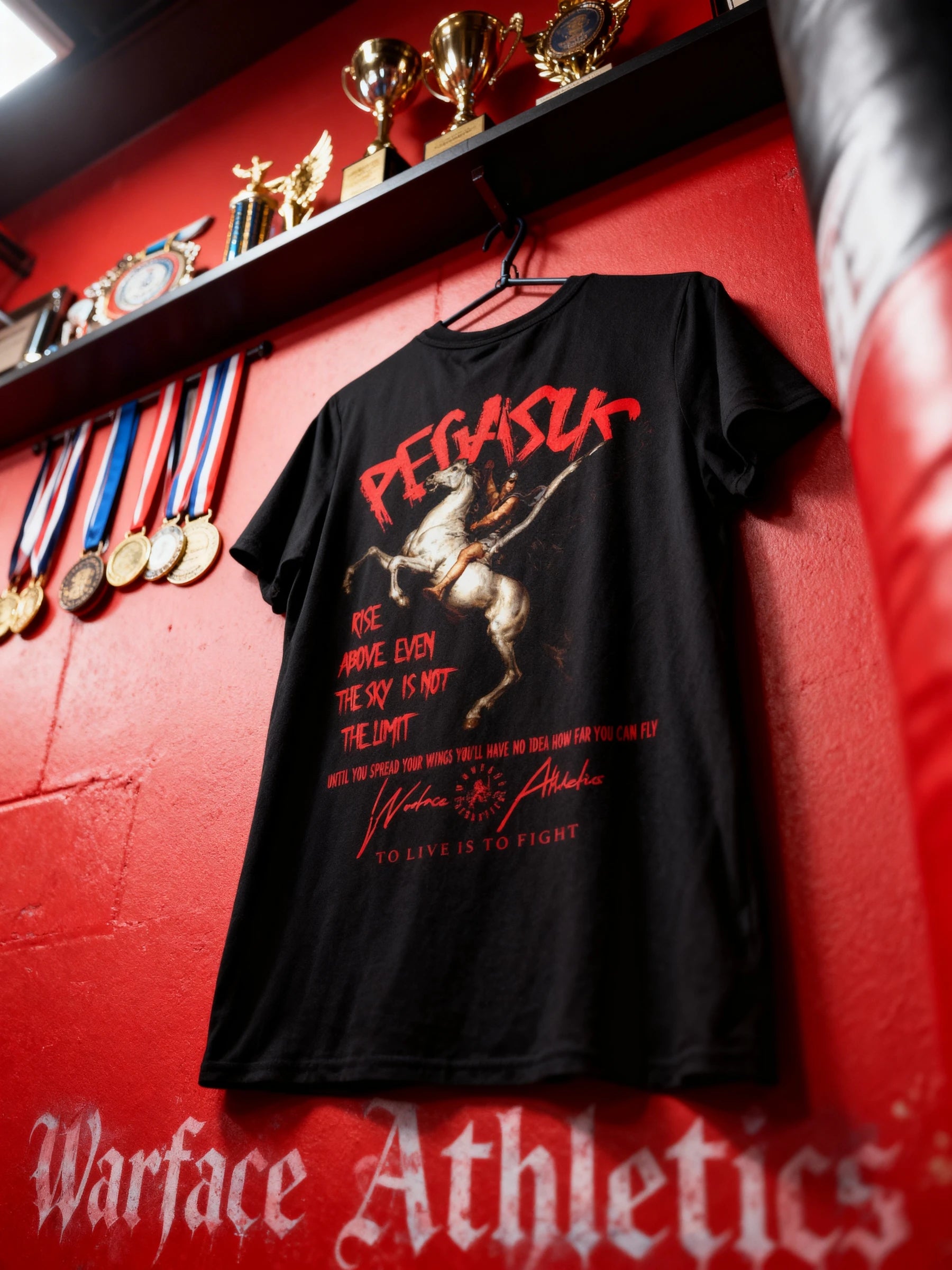 Pegasus Rise Above Tee Display — Men's Greek Mythology Shirt with Warface Athletics Branding on Red Background