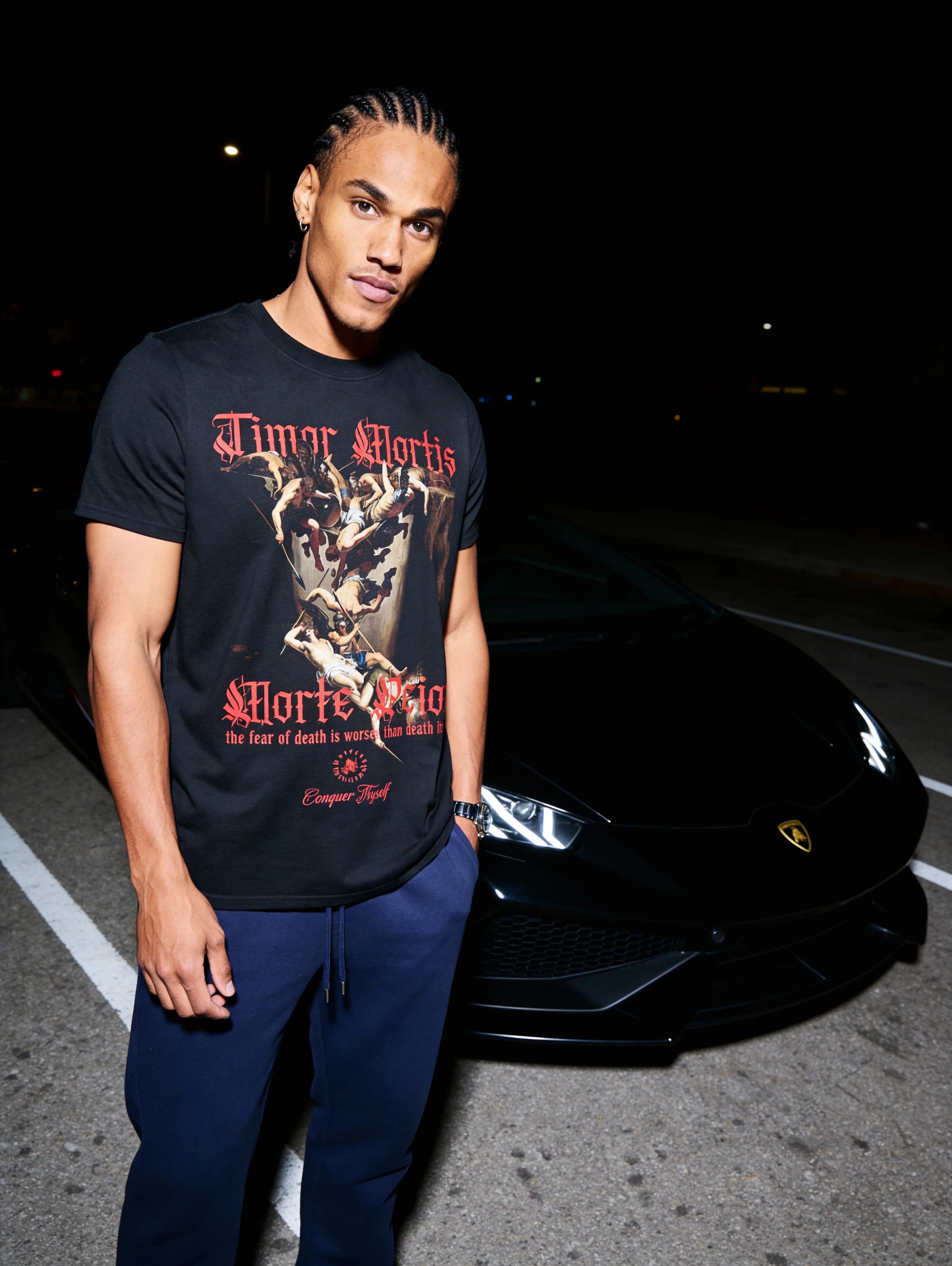 Graphic tees for guys – athlete in Timor Mortis Latin quote gym tee, outdoor night lifestyle – Warface Athletics