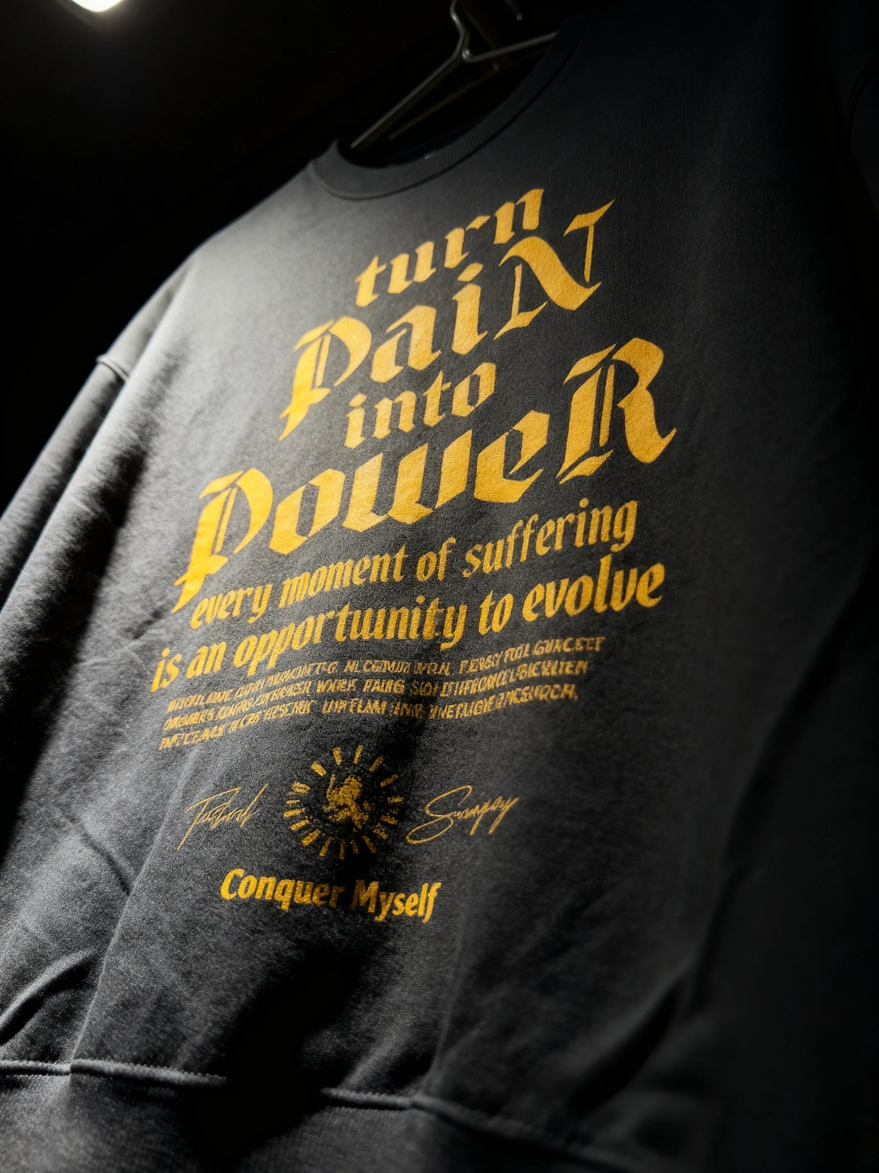 Turn Pain Into Power sweatshirt close-up – yellow gothic stoic text front print, men's pump cover crewneck detail. Warface Athletics.