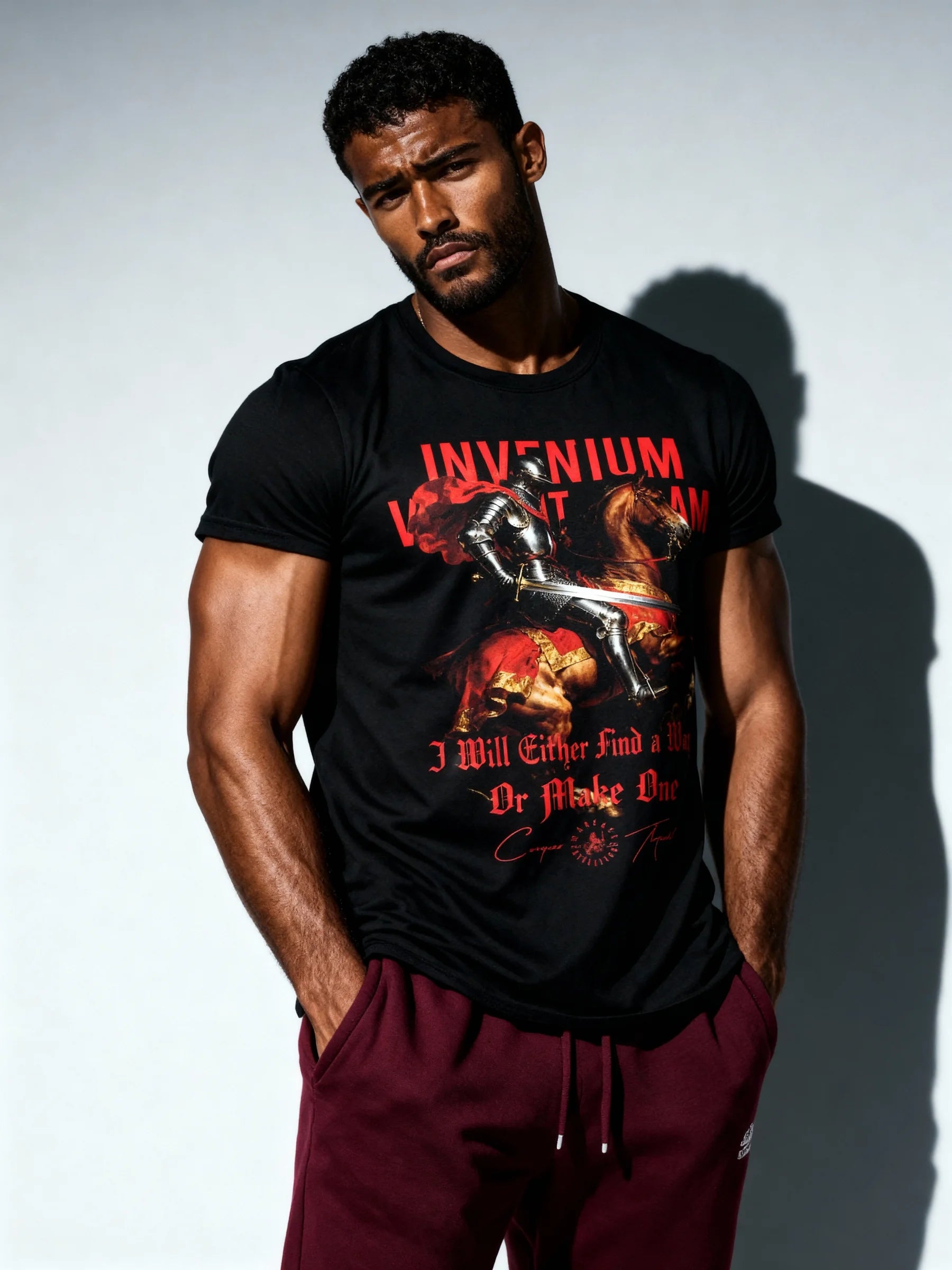 Men's Invenium Viam Aut Faciam heavyweight tee – model in medieval knight gym shirt, white background. Warface Athletics.