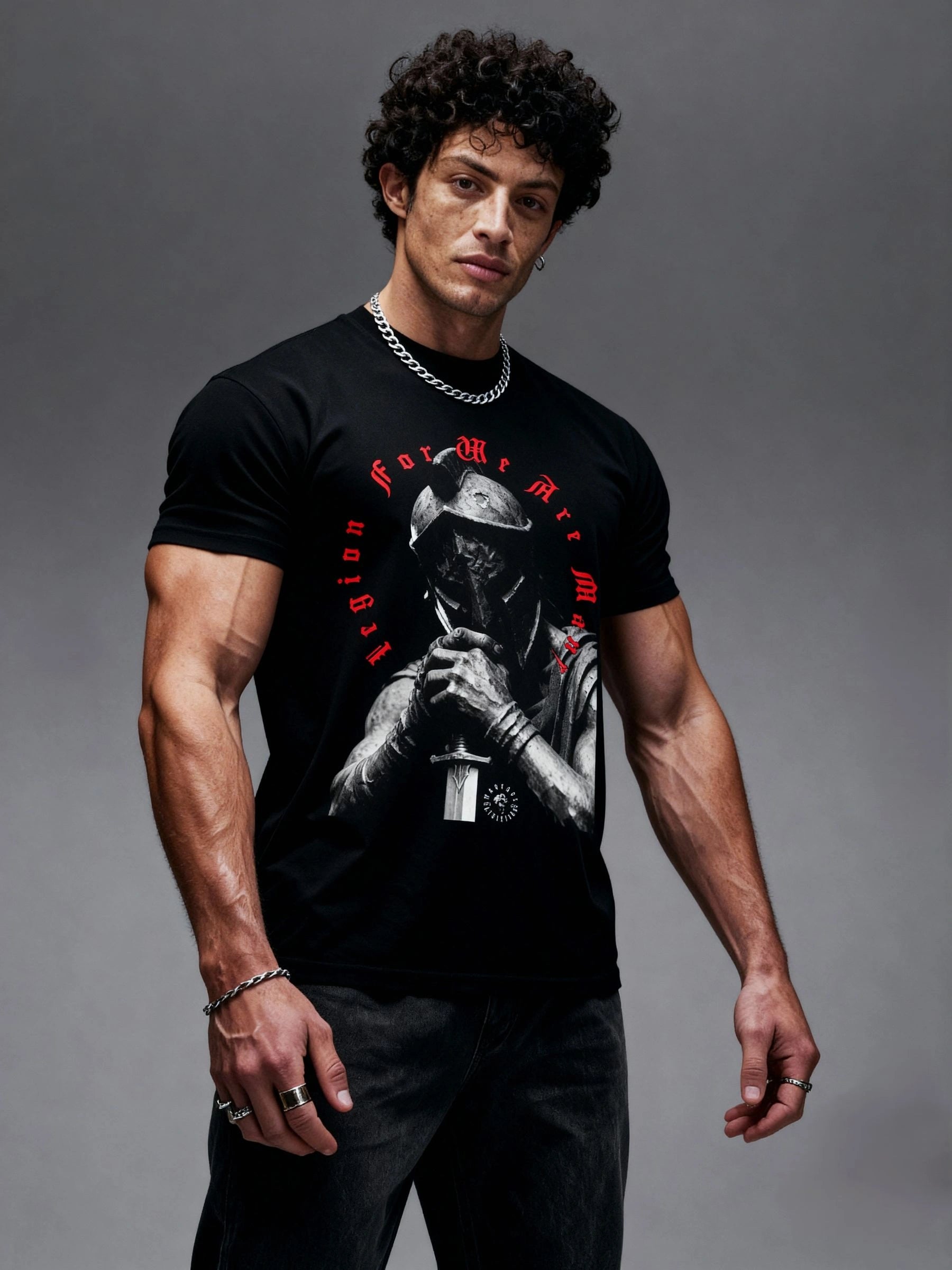 Legion For We Are Many gym shirt – muscular model wearing kneeling warrior graphic tee, gray background. Warface Athletics.
