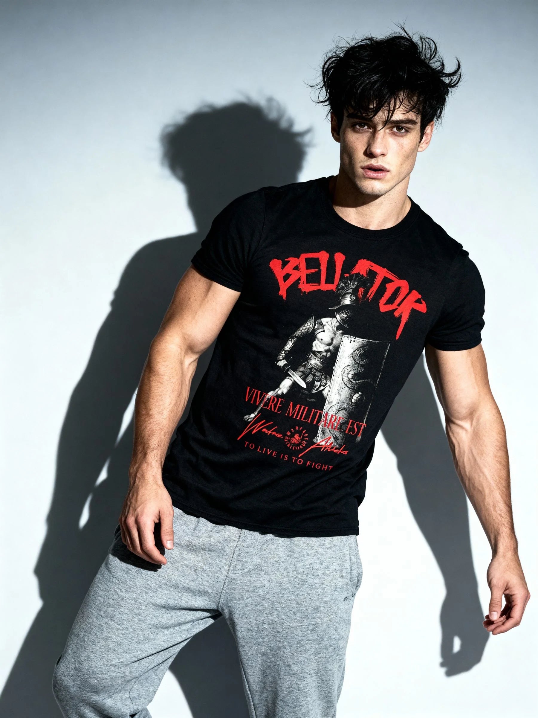 Men's gladiator graphic gym shirt – model in Vivere Militare Est heavyweight tee, athleisure streetwear. Warface Athletics.
