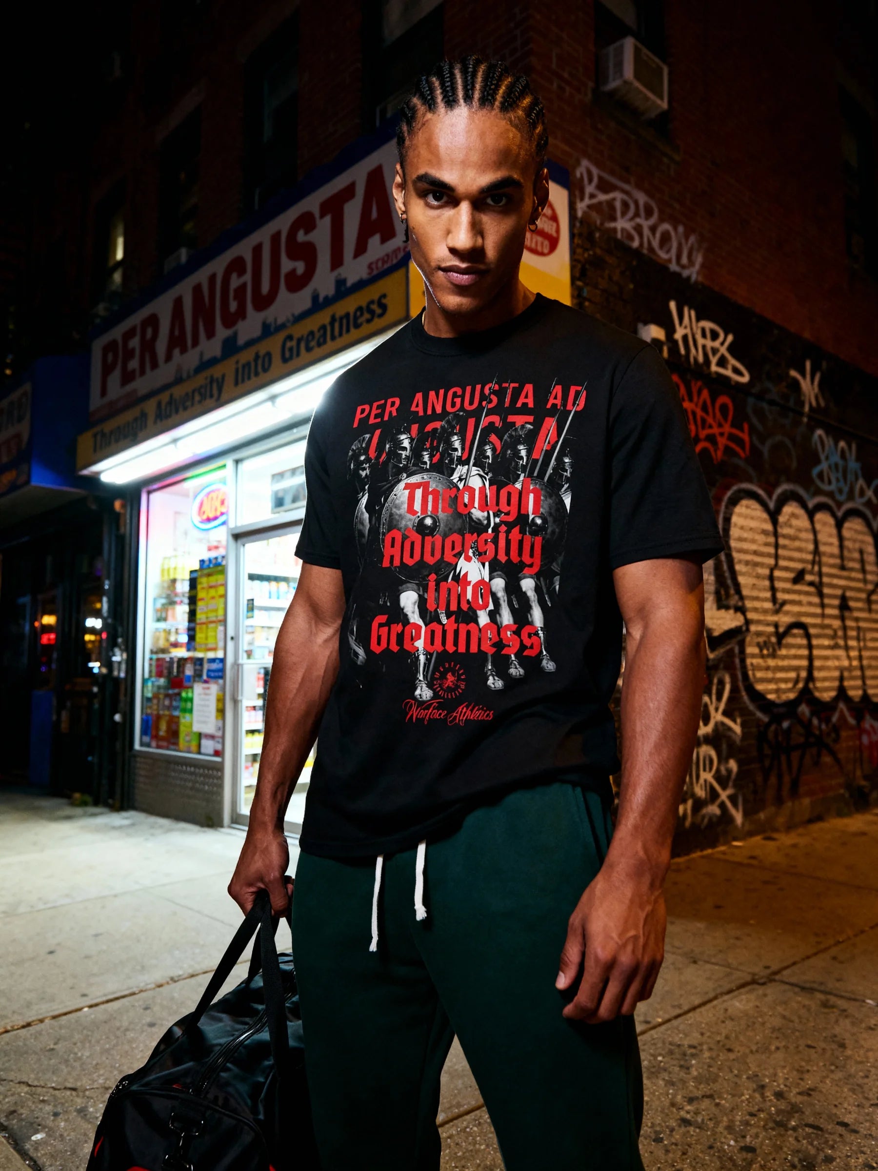 Athletic apparel men – model in Spartan phalanx gym tee warehouse lifestyle shot dark moody – Warface Athletics