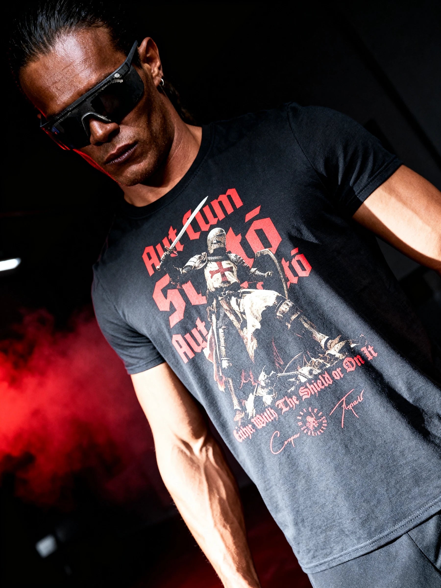 Men's Templar knight heavyweight gym shirt – bodybuilder in crusader graphic tee, red smoke dark background.