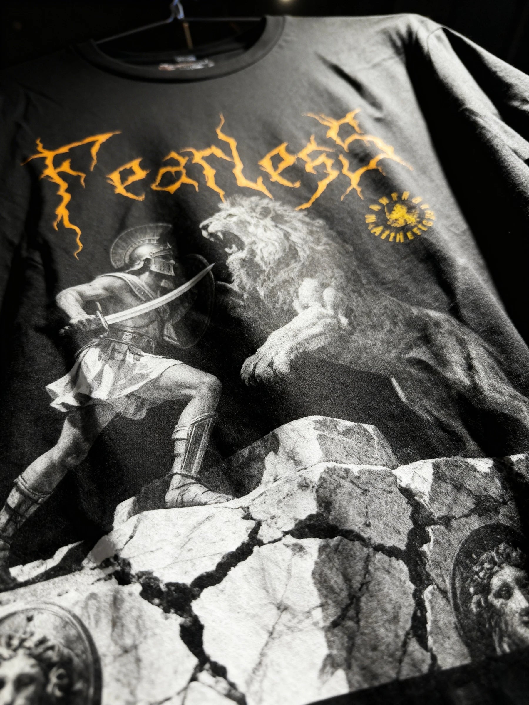 Fearless Spartan vs lion graphic tee on dark background – men's warrior gym shirt, gym outfit for guys. Warface Athletics.
