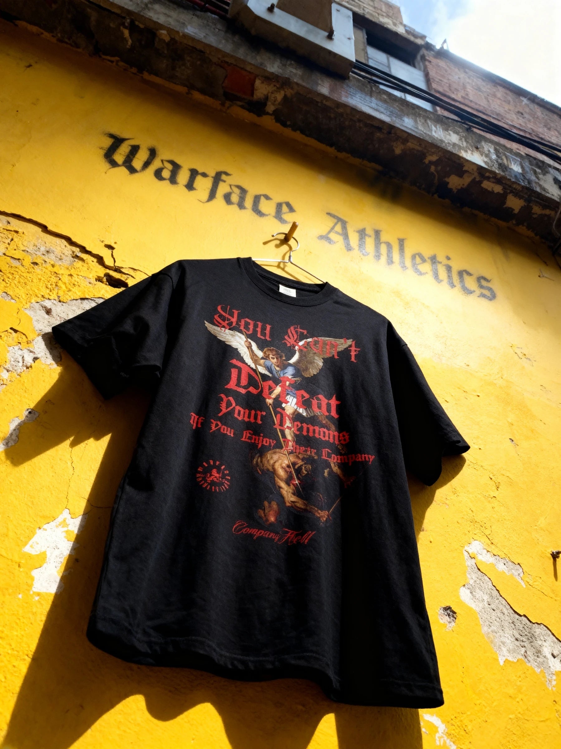 St. Michael archangel graphic t shirt on yellow wall – men's dual-sided heavyweight gym shirt. Warface Athletics.