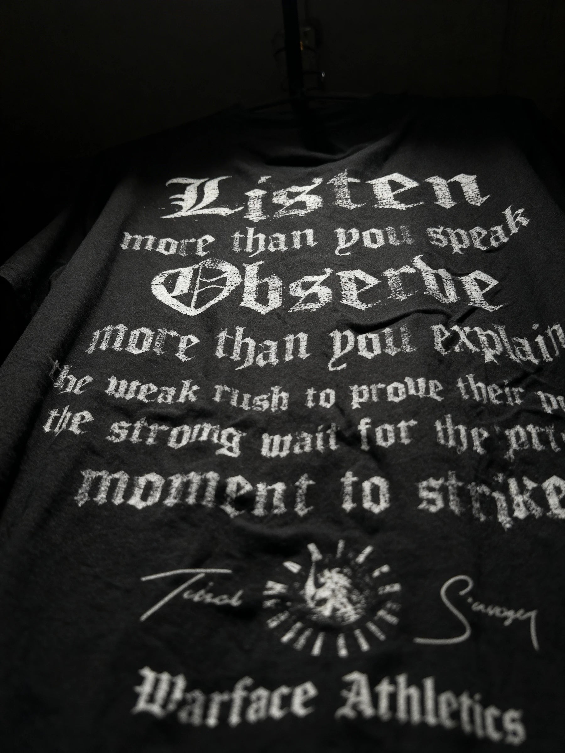 Listen Observe Tee Flat Lay — Men's Black Stoic Quote T-Shirt with Gothic Listen Observe Text by Warface Athletics