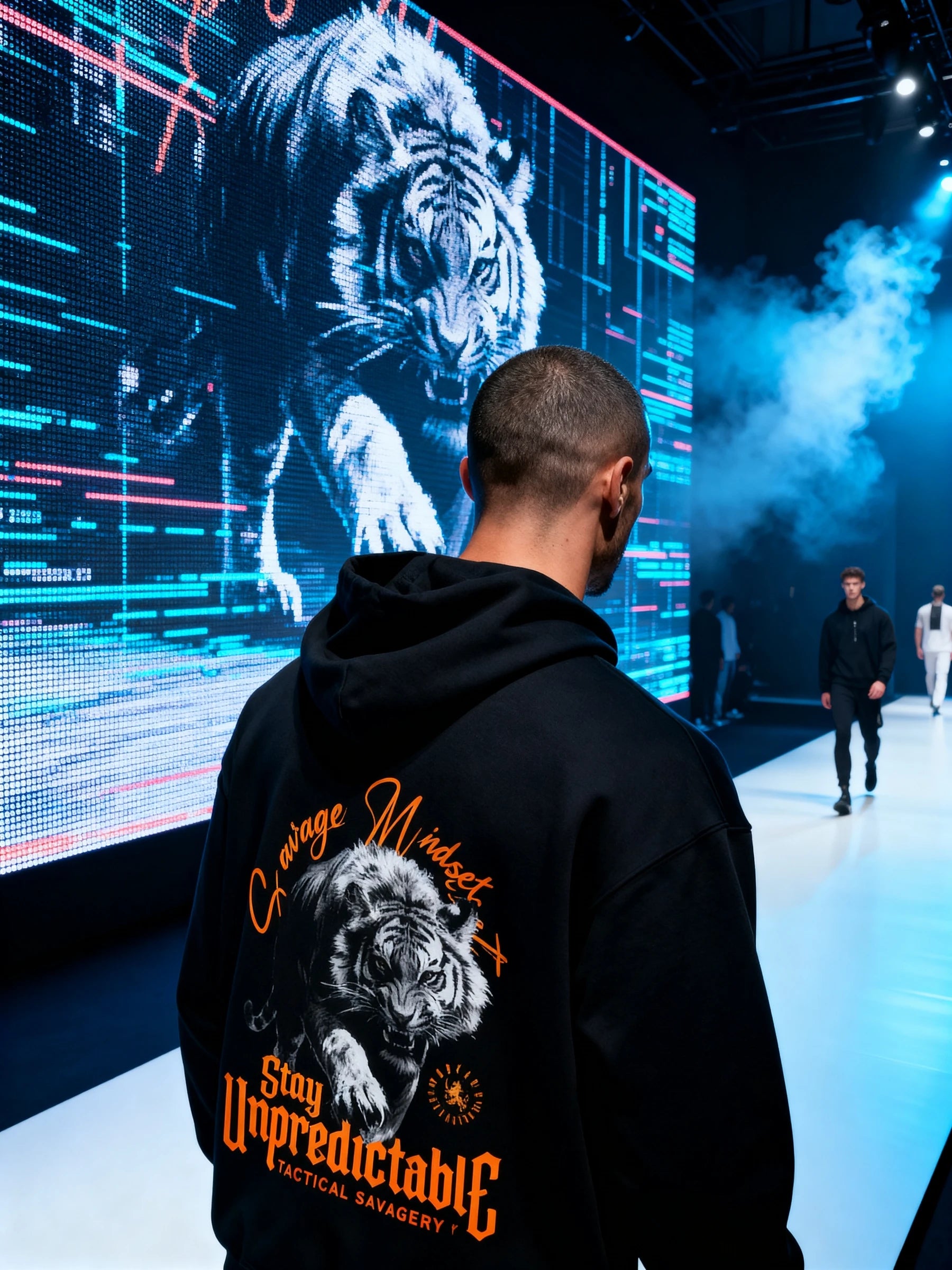Men's Stay Unpredictable tiger gym hoodie – streetwear model in front of digital display, athletic apparel for men.