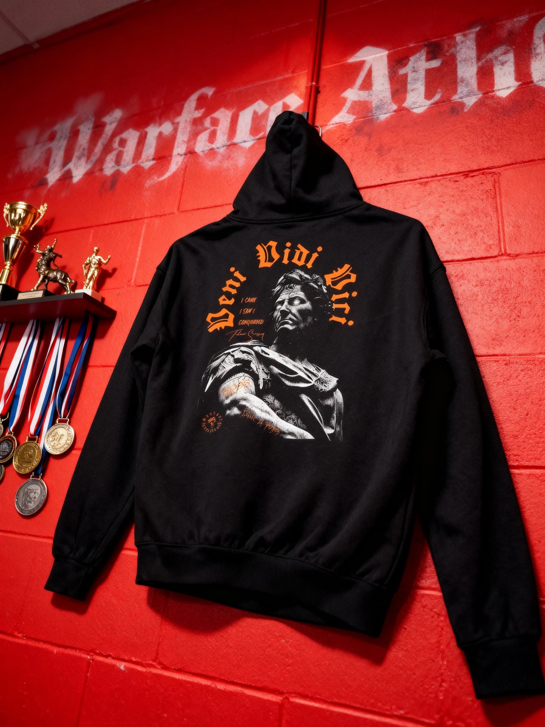 Veni Vidi Vici gym hoodie on red Warface Athletics wall – Julius Caesar roman emperor graphic hoodie, pump cover for men.