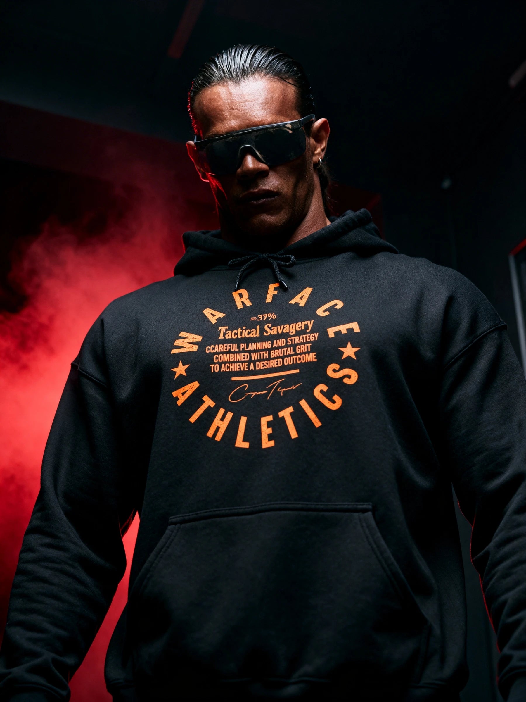 Men's Julius Caesar gym hoodie – athlete wearing Veni Vidi Vici black hoodie, dark background. Warface Athletics.