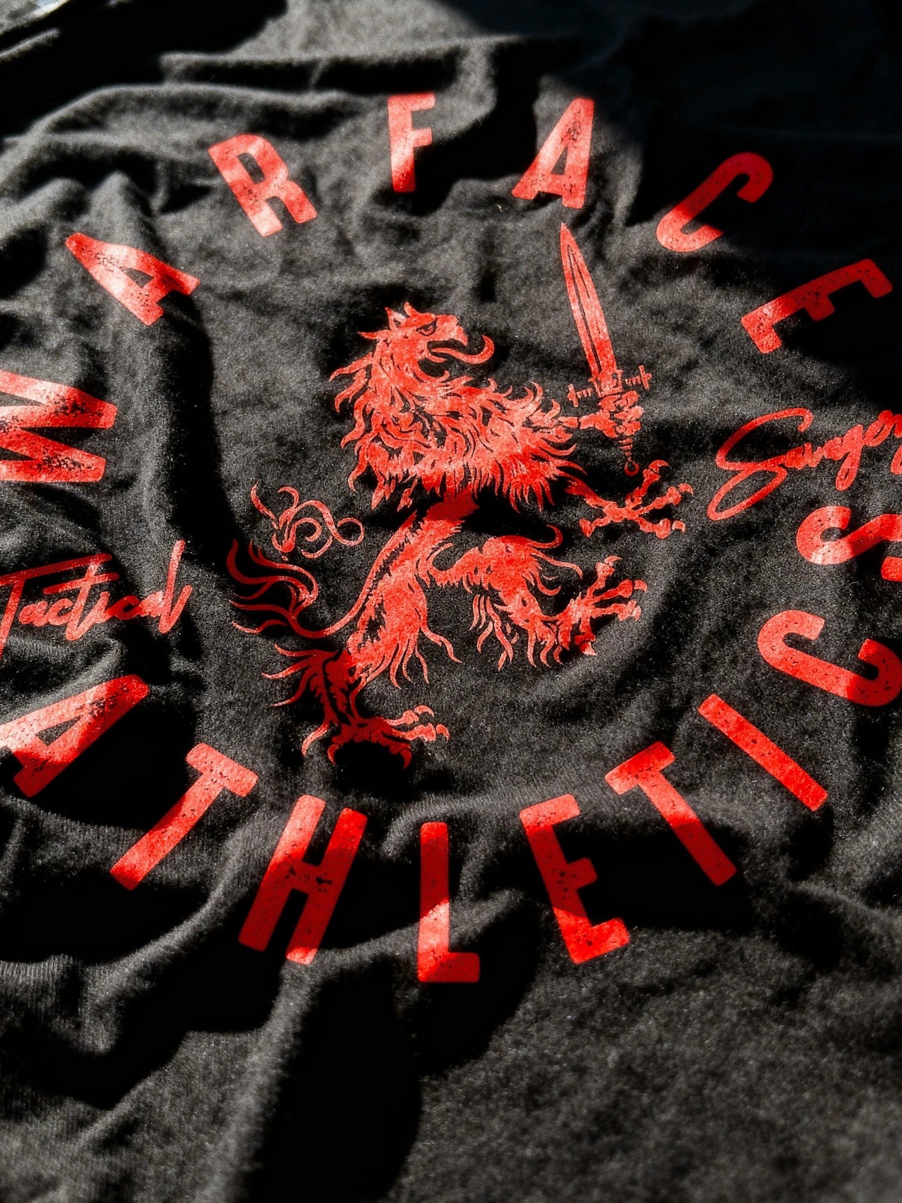 Black gym t-shirt with red text and lion design, featuring 'Warface Athletics' branding.