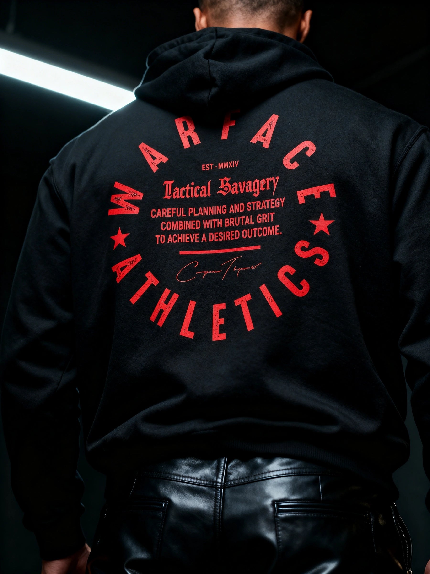 Men's heraldic lion gym hoodie back close-up – Tactical Savagery Warface Athletics red circle crest print detail.